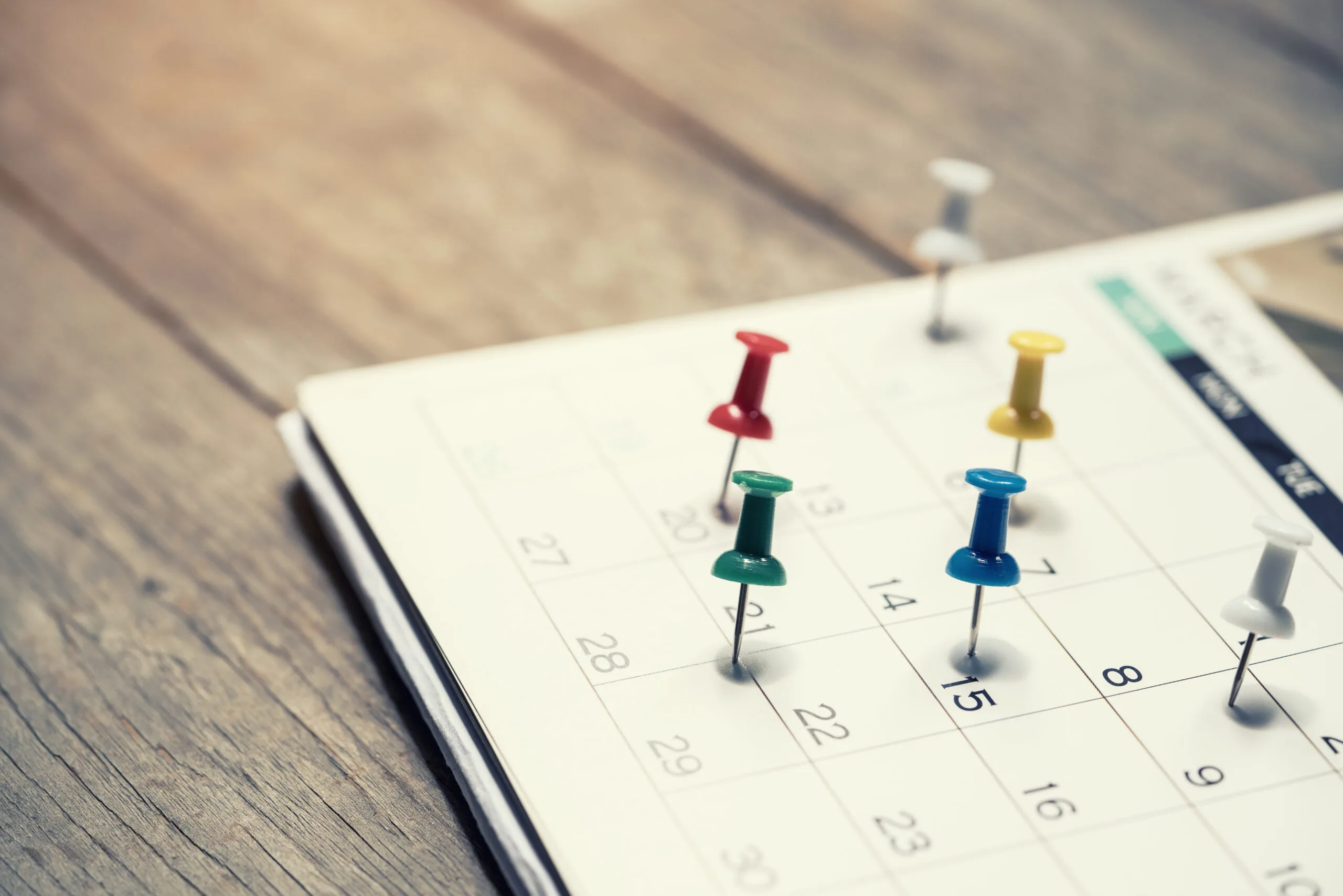 close up of calendar on the table, planning for business meeting or travel planning concept